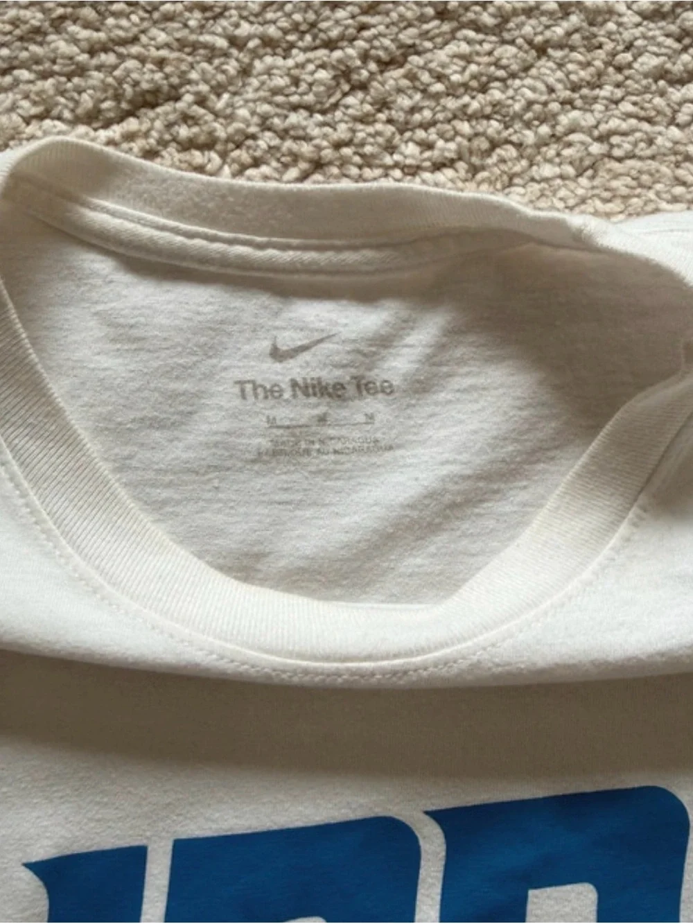 Nike White Short-Sleeve 'LIONS' Graphic Tee with Blue Logo
